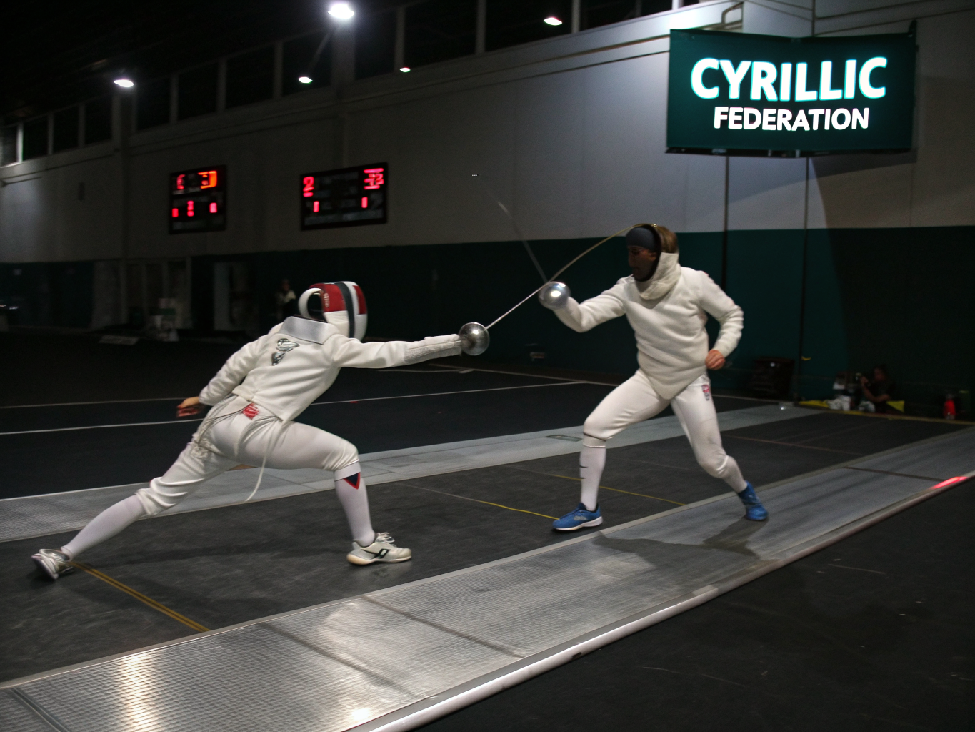 Two fencers performing the traditional salute before a bout